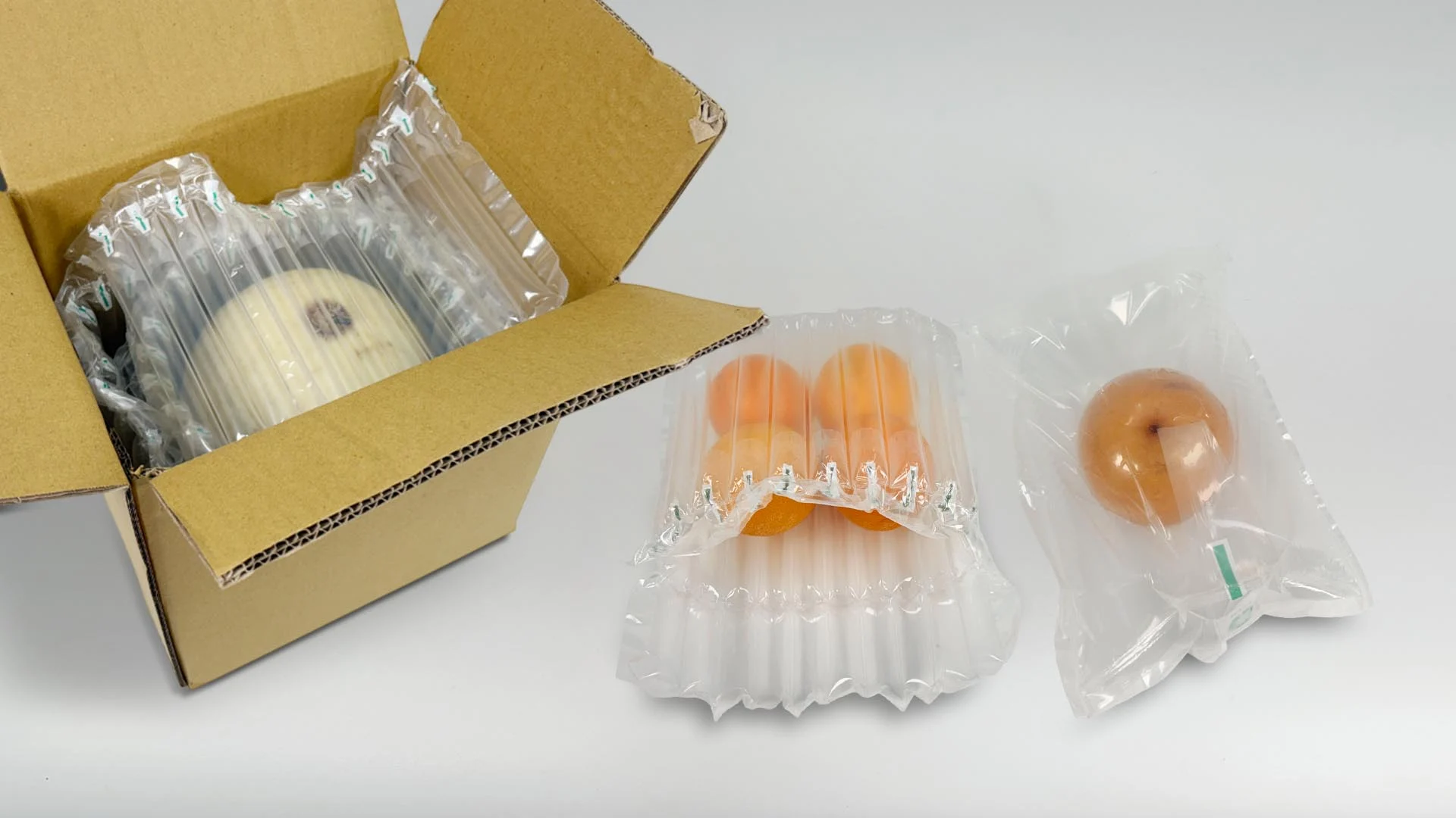 農產品包裝防護示範,展示氣泡布、氣柱袋與雙層緩衝袋中袋等水果包裝方式